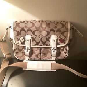 White and tan coach bag.